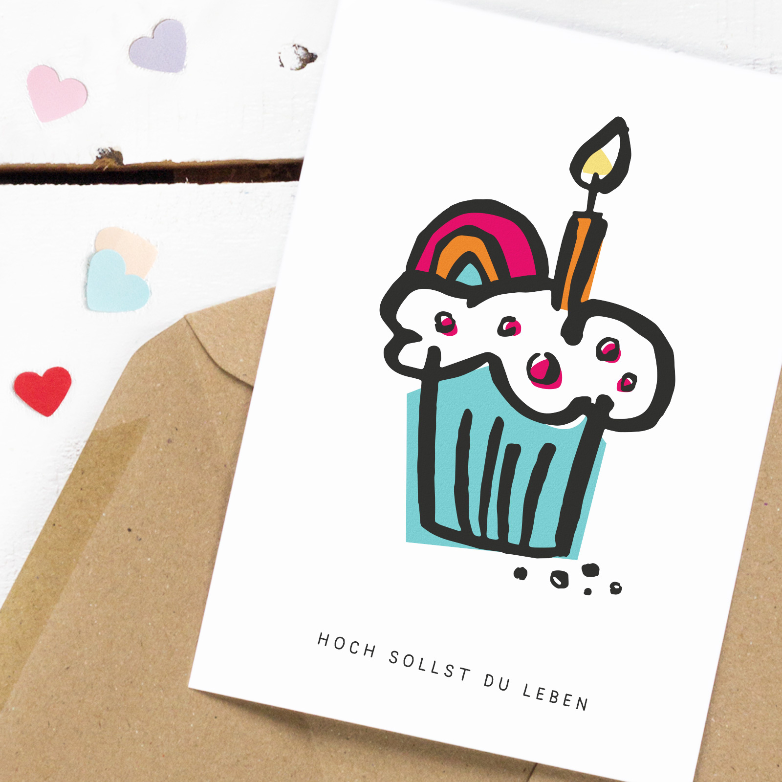 Postkarte mit Muffin, Regenbogendeko, Kerze und Spruch "hoch sollst du leben" darunter